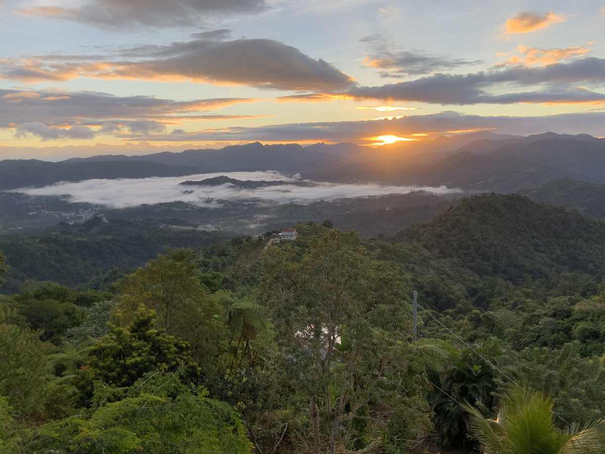 Sunset over the layered mountain ridges