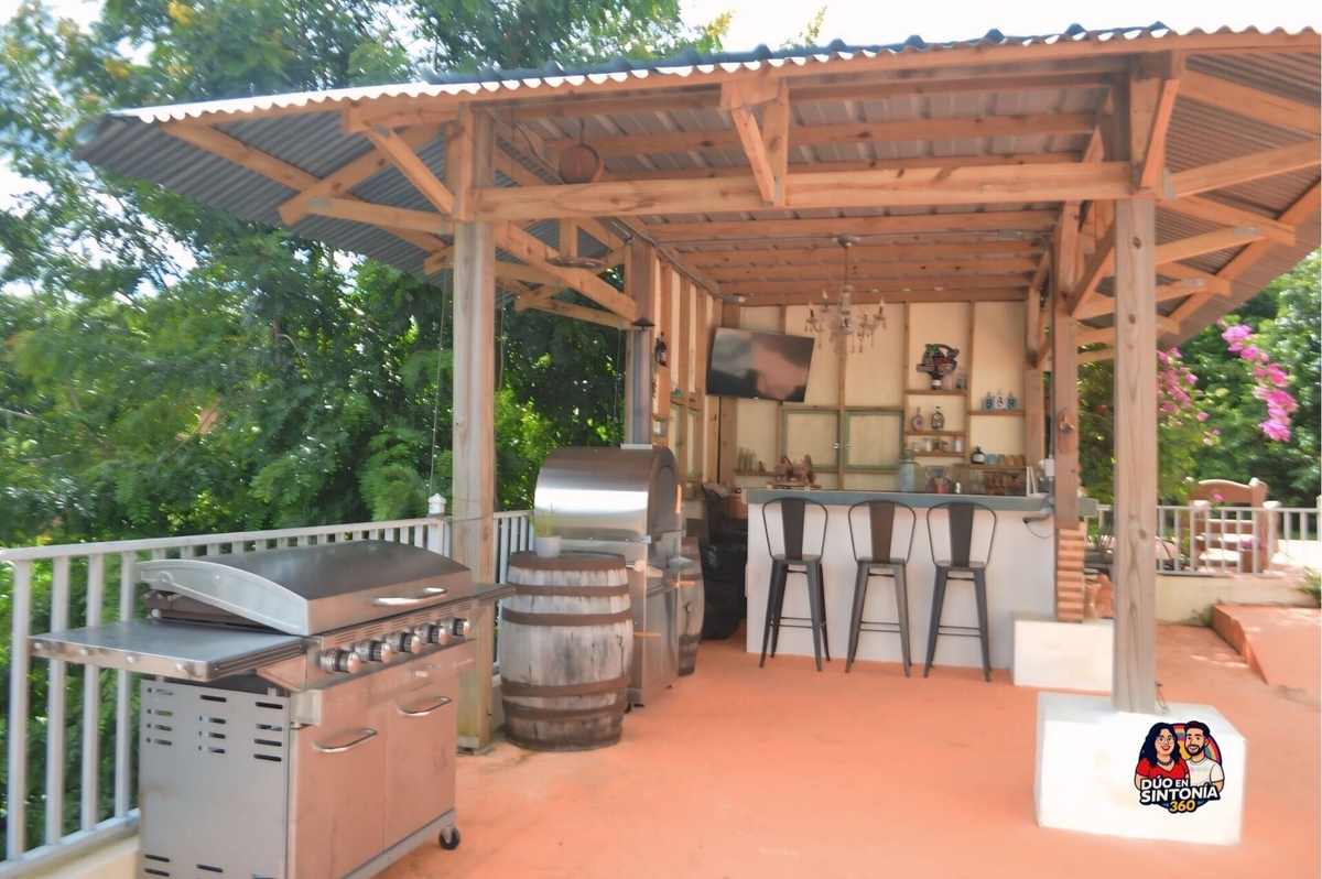 Covered outdoor kitchen and grill pavilion