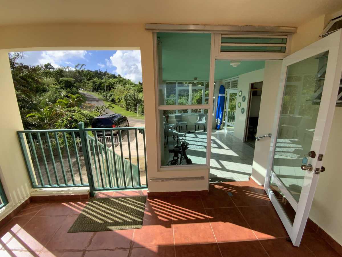 Covered porch opening to the pool terrace